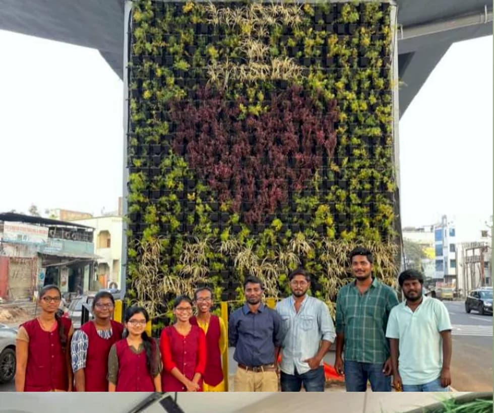 Vruksha Kuteeram team at a vertical garden project from the company brochure